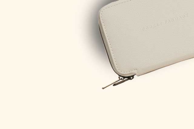 A woman breathes in the fresh air with her eyes closed.